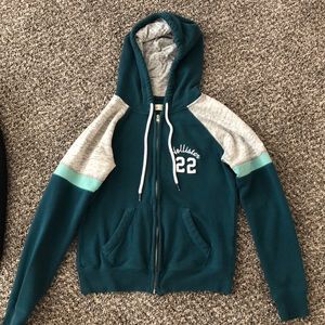 Two medium sizes hollister zip up hoodies.